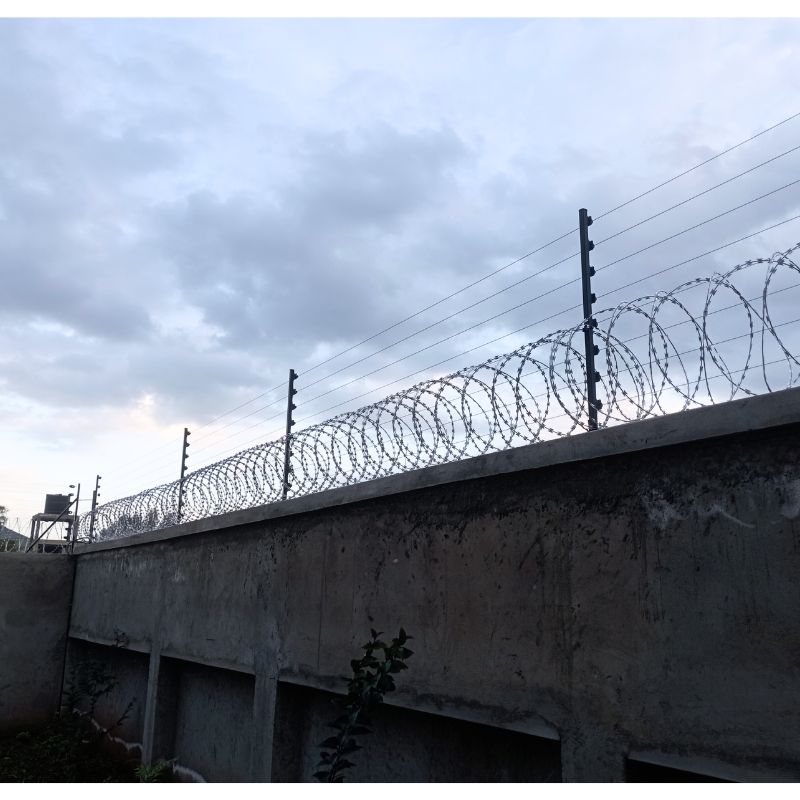 Install an electric fence with razor wire in Kenya